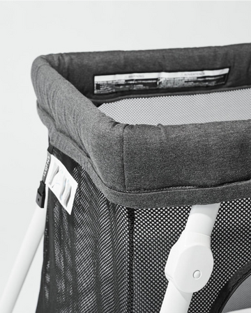 A close up detail of the Lotus Travel Crib